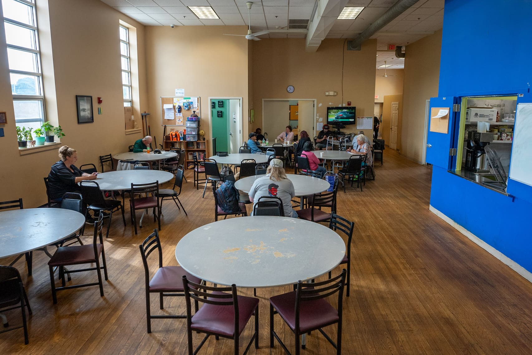 A group of guests embrace at "Together for Women"