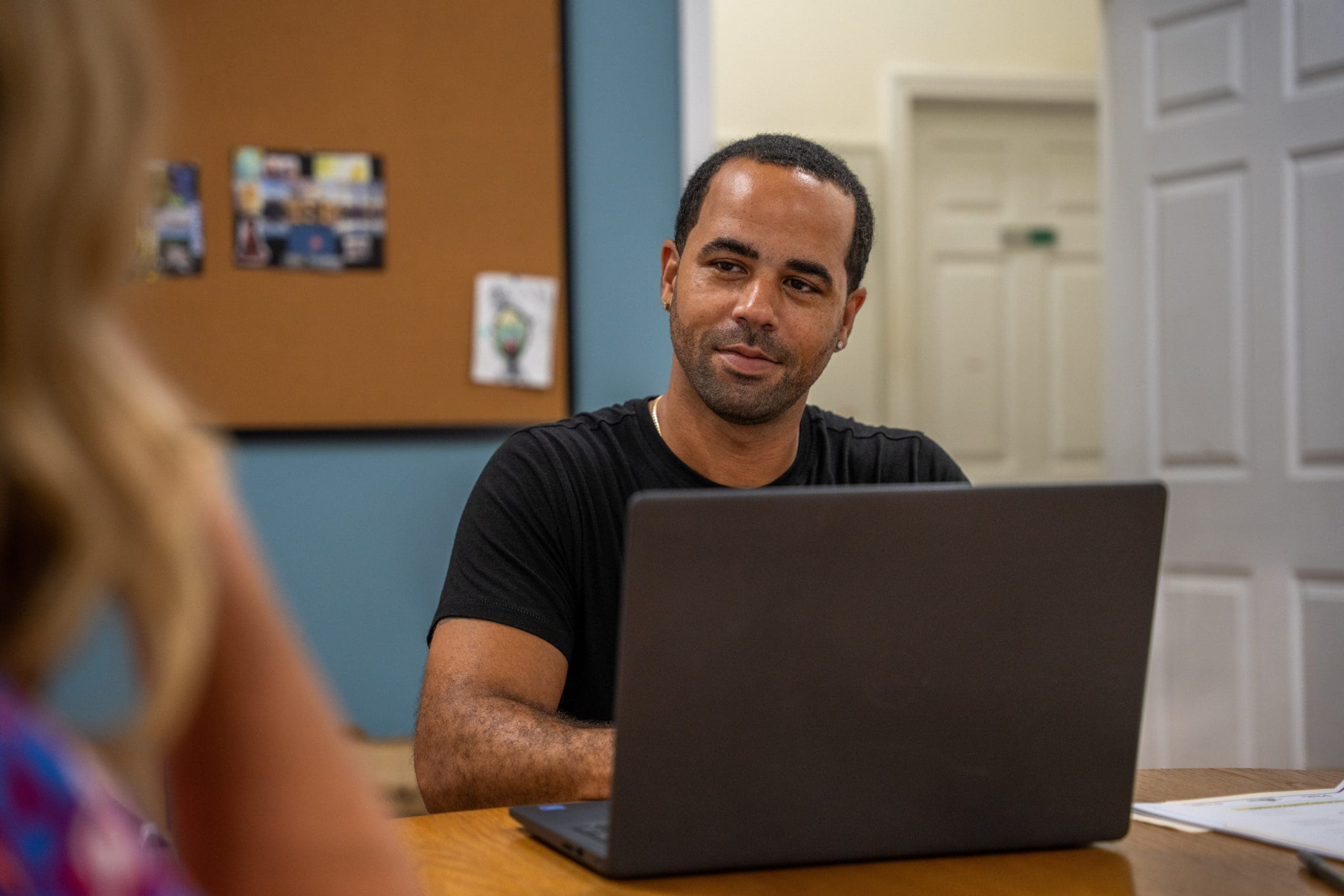 A group of guests embrace at "Together for Women"