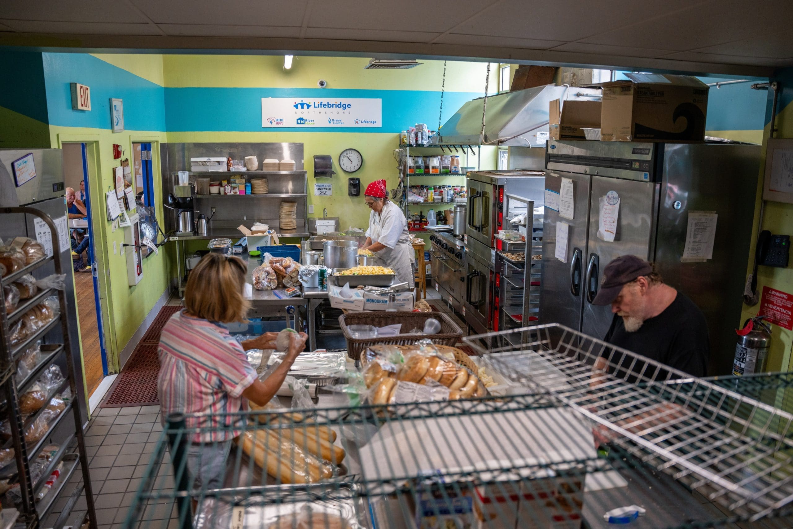 A group of guests embrace at "Together for Women"