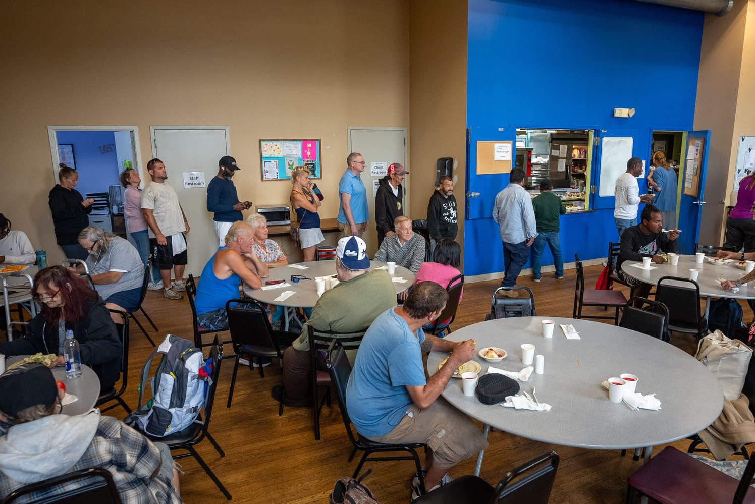 A group of guests embrace at "Together for Women"