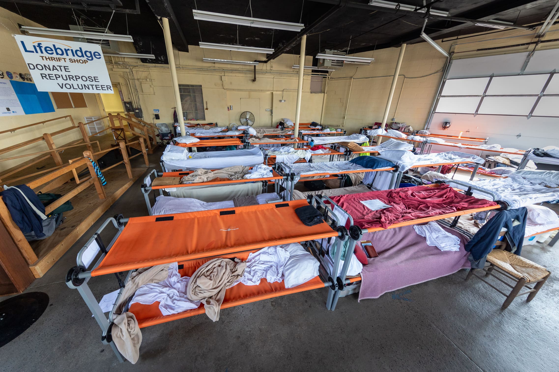 A group of guests embrace at "Together for Women"