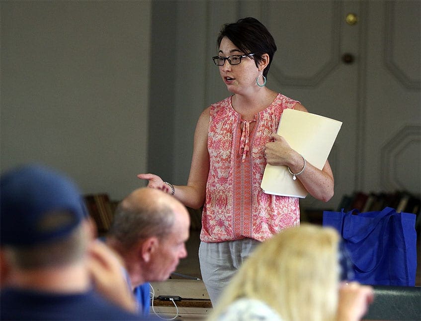 A group of guests embrace at "Together for Women"
