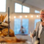 Al Tempkin MC's a Fund a Need paddle raising event at Breaking Bread, Building Hope