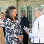 Honoree Karen Andrews smiles at a guest at Breaking Bread, Building Hope