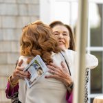 A photo of two guests embracing at Breaking Bread, Building Hope