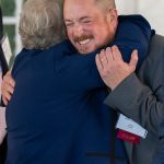 Lifebridge President Jason Etheridge embraces a guest at Breaking Bread, Building Hope