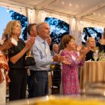 Guests applaud Honoree Karen Andrew at Breaking Bread, Building Hope
