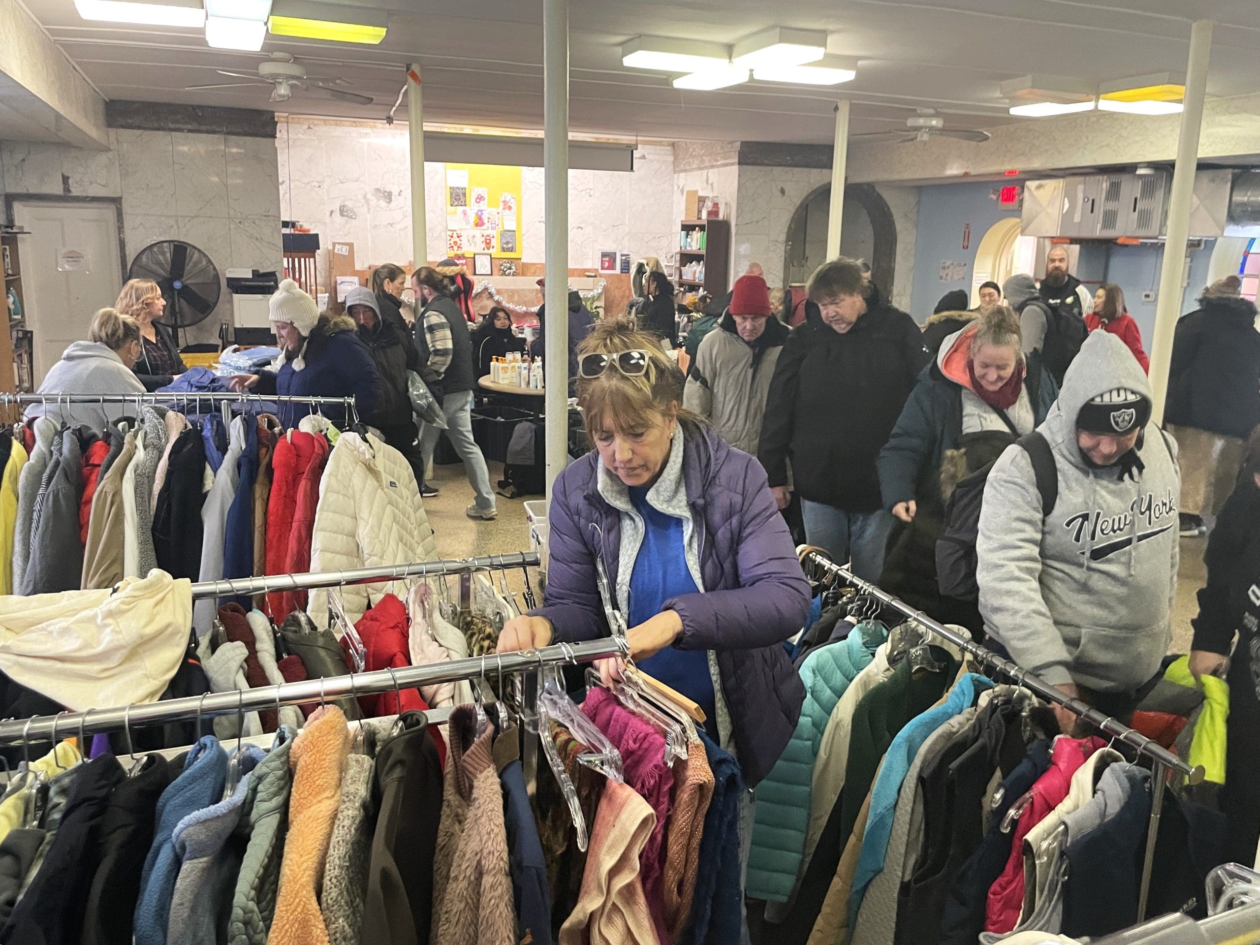 IMG_1413 People experiencing street homelessness browse winter coats at this year's Giving Day Event, The Lifebridge Backpack Program