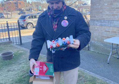 Man opening new box of Christmas lights