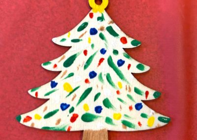 Hand painted white Christmas tree ornament with colorful polka dots