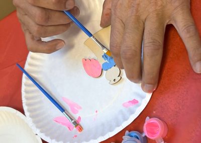 Someone painting an angel ornament
