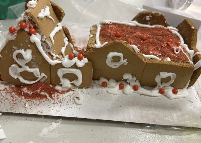 A gingerbread house with red sprinkles
