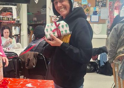 Woman holding up a present